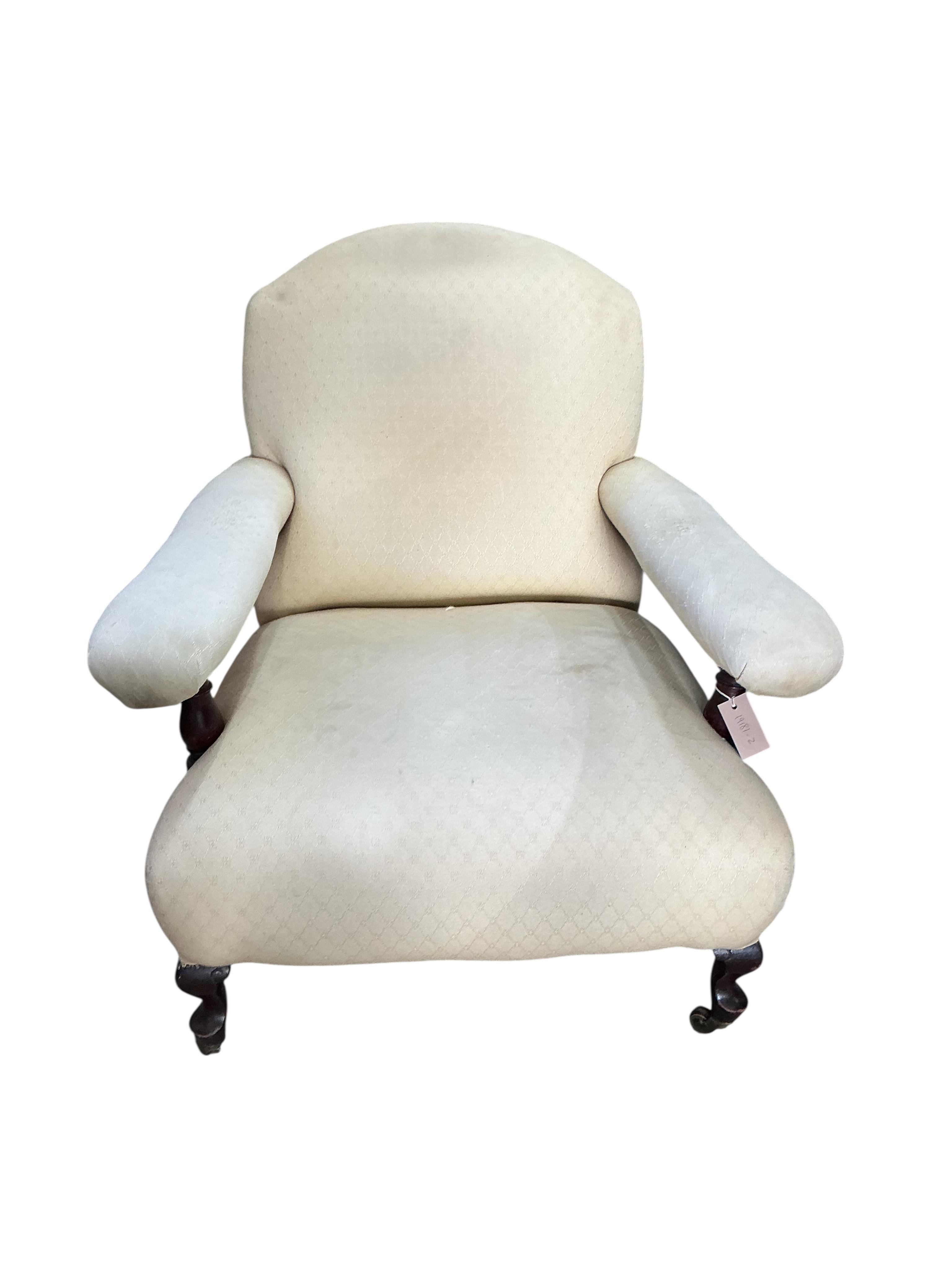 A late Victorian upholstered open armchair, width 78cm, depth 80cm, height 78cm
